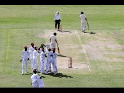 ap
West Indies’ layers celebrate the dismissal of England’s Rory Burns during day one of the second Test match at the Sir Vivian Richards Stadium in North Sound, Antigua and Barbuda, yesterday.