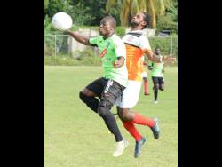  Ian Allen
Tivoli Gardens FC’s Shavar Campbell (left) tries to take the ball on his chest, while being pressured by Dunbeholden FC’s Shevan James during a Red Stripe Premier League match at Royal Lakes in St Catherine, on Sunday, February 3, 2019.