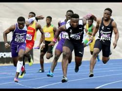 
Jamaica College Chislon Gordon (second right) awaits the baton exchange from his teammate before going on to anchor his team to a win in the Class One boys 4x100m relay at the Gibson McCook Relays at the National Stadium on Saturday, February 24, 2018. 