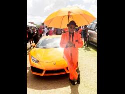 
Paul Blake, president of the Port Antonio Taxi Association, poses in front of this posh Lamborghini which is owned by PNP councillor Hugh Graham. Blake was among hundreds of mourners who attended the funeral for slain Member of Parliament for East Portland, Dr Lynvale Bloomfield. 