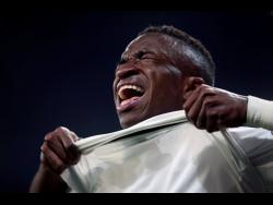 AP
The injured Real forward Vinicius Junior reacts during the Champions League round of 16 second-leg match between Real Madrid and Ajax at the Santiago Bernabeu Stadium in Madrid on Tuesday, March 5. 