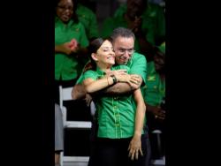  Lionel Rookwood
West Portland MP Daryl Vaz hugs his wife, Ann-Marie, who the party plans to put forward to contest the April 4 East Portland by-election.
