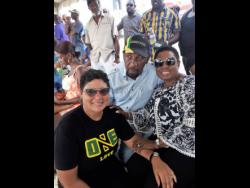 Member of Parliament for South East Clarendon Rudyard Spencer (centre) lymes with People’s National Party caretaker for the constituency, Patricia Duncan Sutherland (left), and Minister of Sport Olivia Babsy Grange.