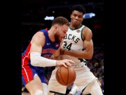Detroit Pistons forward Blake Griffin is defended by Milwaukee Bucks forward Giannis Antetokounmpo (34) during the second half of Game 4 of a first-round NBA basketball playoff series on Monday.