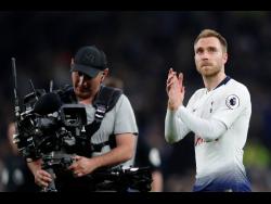 Tottenham’s Christian Eriksen greets fans after the English Premier League soccer match  against Brighton & Hove Albion in London yesterday.
