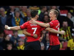 Southampton’s Shane Long celebrates scoring his side’s goal against Watford during their English Premier League match at Vicarage Road in Watford, London, England, yesterday.