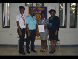 Victoria Campbell (second right), grade-11 student of Mt Alvernia High School and member of the Custom-Made Optimist Club,with her award. From left are Jacinth Mighty, president of the club; Richard Robinson, lieutenant-governor of the Optimist International Club’s Caribbean District Zone Four; and Michelle Bryan, new club building chairperson of the Optimist International Club’s Caribbean District.