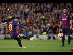 Barcelona’s Lionel Messi hits a spectacular free kick to score his side’s third goal during the first-leg UEFA Champions League semi-final match against Liverpool at Camp Nou in Barcelona, Spain,yesterday. 
