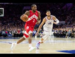 Toronto Raptors’ Kawhi Leonard (left) in action against Philadelphia 76ers’ Ben Simmons during the second half of Game 4 of a second-round NBA basketball play-off series on Sunday.