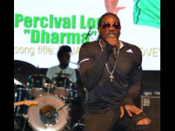 Wild card Percival Lord, aka Dharma, performing his entry song, ‘A Jamaica We Love’, at the  2019 Jamaica Festival Song competition launch held at  Emancipation Park last Thursday.