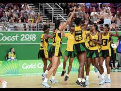 Members of Jamaica’s Sunshine Girls team react after a win at the Commonwealth Games in Gold Coast, Australia, where they won the bronze medal in April 2018.