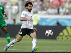 In this June 25, 2018 file photo, Egypt’s Mohamed Salah chases the ball during the Group A match between Saudi Arabia and Egypt at the 2018 World Cup at the Volgograd Arena in Volgograd, Russia.  