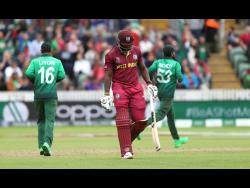 West Indies’ Andre Russell walks off the field after being dismissed during the Cricket World Cup match against Bangladesh.