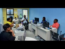 Powell leads a meeting with his staff.