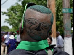 Everton Maitland is convinced that the image at the back of his head is that of Edward Seaga.