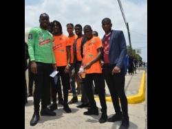 Members of the Tivoli Gardens Football Club arrive for the state funeral of former Prime Minister  Edward Seaga at the Holy Trinity Cathedral on North Street, Kingston.