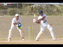 Batsman Andre McCarthy (right) of Junction Ballards Valley in action against Junction Bull Savannah during the St Elizabeth parish final of the SDC/Wray & Nephew National T20 Competition at the Manley Horne Sports Park on Sunday.