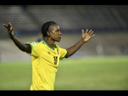 Mattocks raises his arms during a Nations League match against The Cayman Islands at the National Stadium on September 9, 2018.