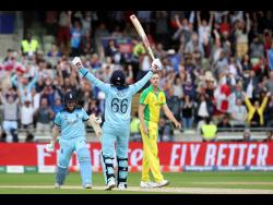 England captain Eoin Morgan (left) celebrates with teammate Joe Root after winning their ICC World Cup semi-final match against arch-rivals Australia at Edgbaston in Birmingham, England, yesterday. 