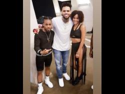 Credit: Contributed Dancers Domani Black and his wife Jay share a moment with superstar Chris Brown at a recent video shoot.