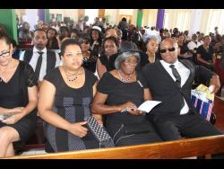 Family members of the late Neville Croasdale at his funeral, held at the William Knibb Baptist Church yesterday.
