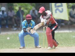 Emeki Jones (right), of White River, in action against Links United at the Three Hills Oval in St Mary in the SDC/Wray and Nephew National T20 competition on Sunday. 