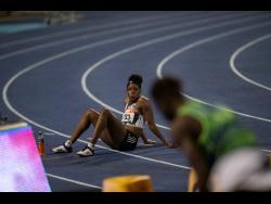 refuses to leave the track moments after she was adjudged to have false started in the 100m hurdles final at the JAAA/Supreme Ventures Limited National Senior Athletics Championships at the National Stadium on Sunday, June 23. File