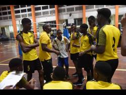 Jamaica Under-19 Men’s Volleyball coach Steve Davis gives his team instructions during the Caribbean Zonal Volleyball Association Youth Tournament at the GC Foster College in St Catherine on Monday. 