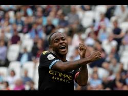 Manchester City’s Raheem Sterling celebrates after scoring his side’s fifth goal during the English Premier League match between West Ham United and Manchester City at London Stadium in London last Saturday.
