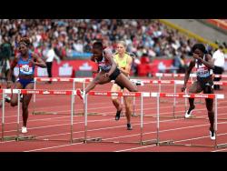 Jamaica’s Danielle Williams (centre) competes on her way to winning the women’s 100m hurdles during the Muller Grand Prix Diamond League event in Birmingham yesterday.