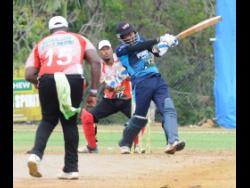 Johnson Mountain’s Gavaskar Malachi hits a six against the White River Rebels during the third-place play-offs of the SDC/Wray & Nephew National Community T20 Cricket competition.