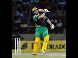 Glenn Phillips of Jamaica Tallawahs celebrates his century during the Hero Caribbean Premier League Play-Off match 32 between St Kitts & Nevis Patriots and Jamaica Tallawahs at the Guyana National Stadium, on September 12, 2018.
