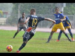 Jamaica College’s Rajae Lawrence (19) takes a shot on goal during their ISSA/Digicel Manning Cup match against José Marti High School at the Ashenheim Stadium on Saturday.