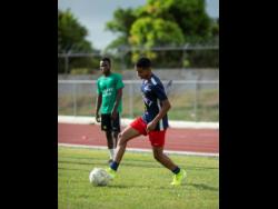 Duncan McKenzie takes part in a training session with the Jamaica College Manning Cup team on September 5, 2019. 