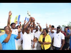 Members of the Longville Park cricket team celebrating their victory in the NHT Cream of the Crop T20 competition on Sunday.