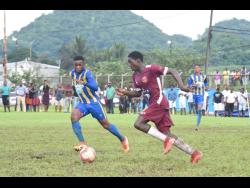 St Elizabeth Technical’s (STETHS) Mushtaq Christopher  (left) and Maggotty High’s  Rohan Palmer battle for the ball during an ISSA/WATA daCosta Cup Group E match at Appleton Sports Complex earlier this month. STETHS won 1-0. 
