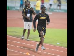 Sprinter André Ewers in training at the Qatar Sports Club in Doha, Qatar, on Wednesday. Team Jamaica coach Bert Cameron can be seen in the background.