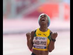 Shelly-Ann Fraser-Pryce celebrates after capturing the gold medal in the women’s 100 metres final at 2019 IAAF World Championships in Doha, Qatar, yesterday. 
