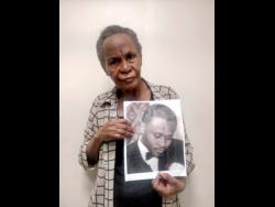 Esther Cunningham shows a photo of her brother Percy.