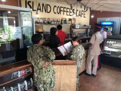 Customers wait to be served in Island Coffee Cafe.
