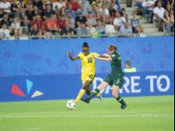 Jody Brown (left) moves away from Australia’s Karly Roetbakken in Jamaica’s first-round clash against the Aussies in the FIFA Women’s World Cup in Grenoble, France, on Tuesday June 18, 2019. 