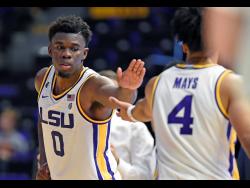 LSU forward Darius Days (0) celebrates the apparent win with teammate Skylar Mays (4) in the second half of an NCAA college basketball game on November 16, 2019. 