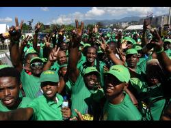 Credit: Gladstone Taylor East Central St Catherine Member of Parliament Alando Terrelonge (centre) is swarmed by supporters on arrival at conference yesterday.