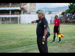 Lenny Hyde instructs Falmouth United’s players from the sideline during their Western Confederation match against Montego Bay United at Jarrett Park on Sunday.