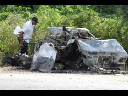 This car burst into fire along Chesterfield Drive in St Andrew last week after being involved in a three-vehlicle crash. Two persons died in the accident.