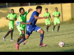 Mount Pleasant’s Suelae McCalla (right) dribbles forward while challenged by Molynes United’s Tyrece Wynter in their Red Stripe Premier League match at the Constant Spring Field on Sunday, December 15, 2019.