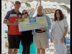 From left:  Glenn Lawrence, CEO of Couples Resorts; Maureen Sheridan, director of Animal House; Paul Issa, deputy chairman of Couples Resorts and Alex Ghisays, Group PR Director of Couples, pose with the ceremonial cheque following the resorts Charity Golf Tournament in Ocho Rios.