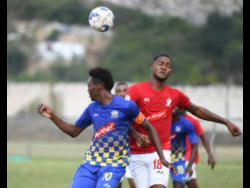Ricardo Makyn/Chief Photo Editor 
Molynes United’s Nicholas Nelson (left) goes up for a header with UWI FC’s Sheldon McKoy during their Red Stripe Premier League encounter at the UWI Bowl on Sunday, January 26, 2020. The game ended 1-1.