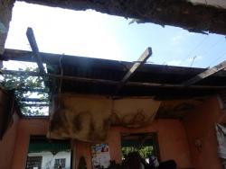 What remains of the roof of McMahan’s home is not very stable.