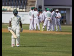 Scorpions batsman Jermaine Blackwood walks back to the pavilion after being dismissed by Veerasammy Permaul in the West Indies Championship match in Trelawny earlier this month on March 7.